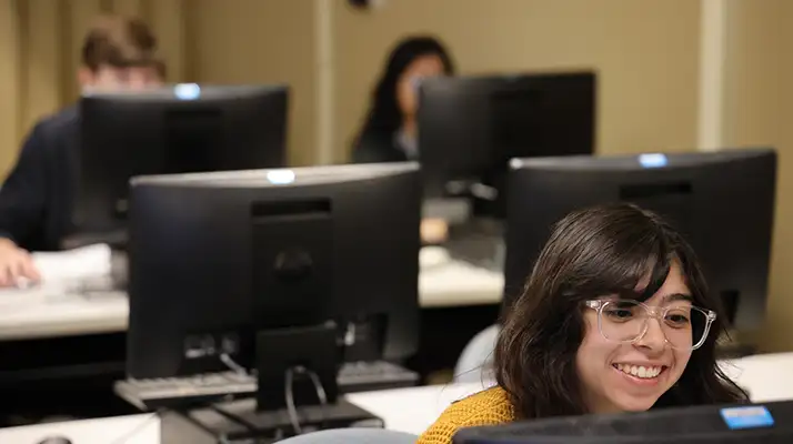 students performing tasks on their desktop computers