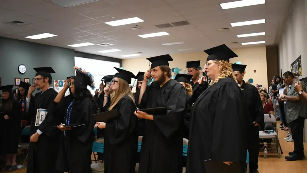 2023 CMC graduates turning their tassels on their caps