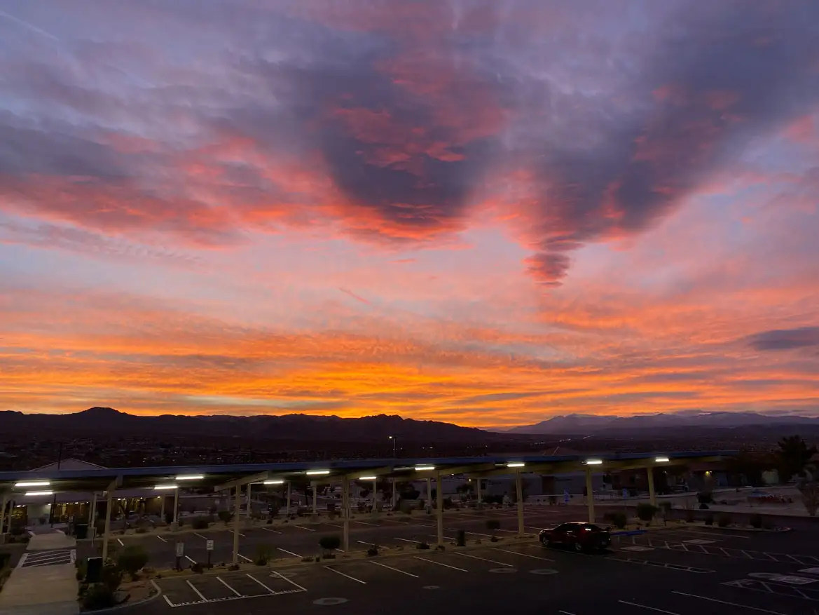 view of the purple, pink and orange sunset