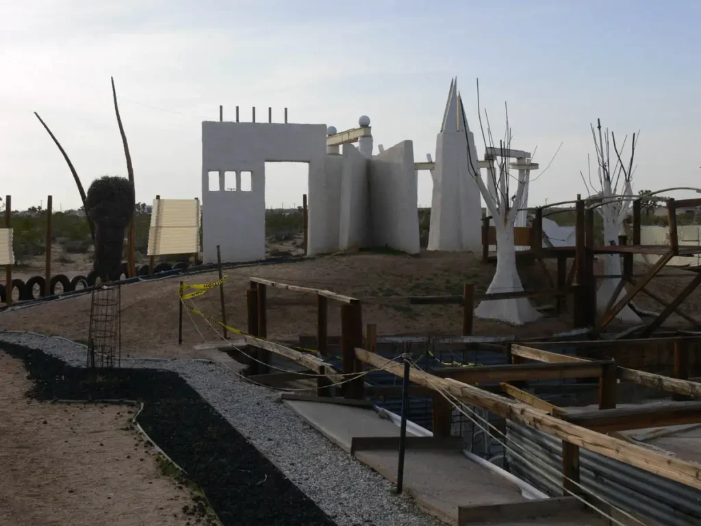 random structures and wood planks in the middle of the desert